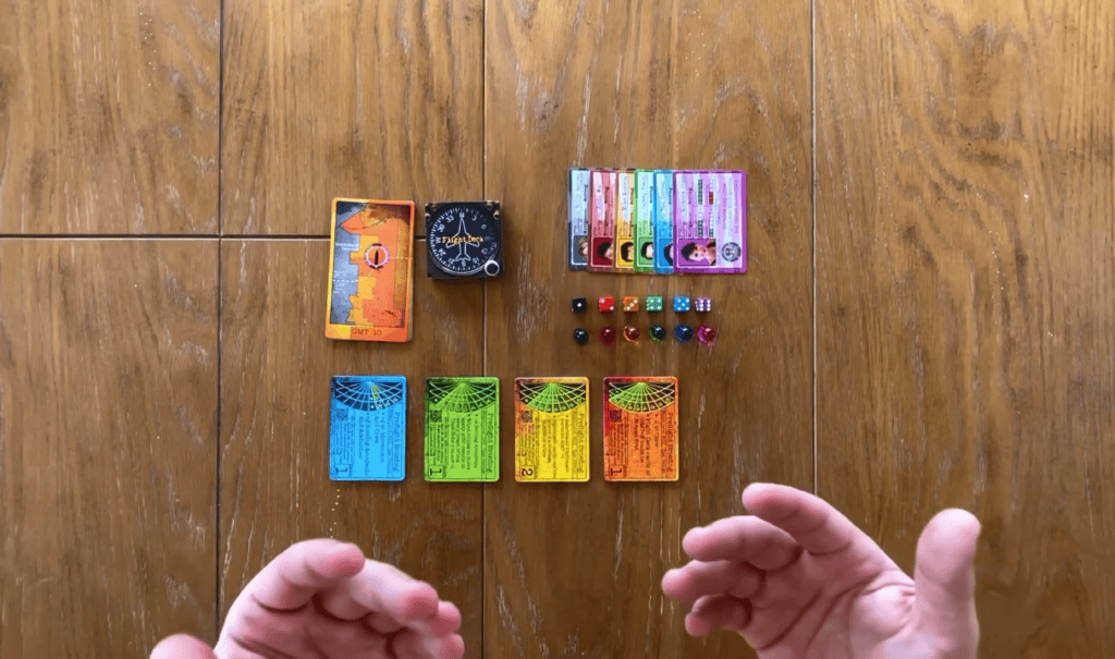 This photo showcases a screenshot from the rule book video tutorial for The Great Chase. It has all of the game components on the tabel for me to describe the game setup