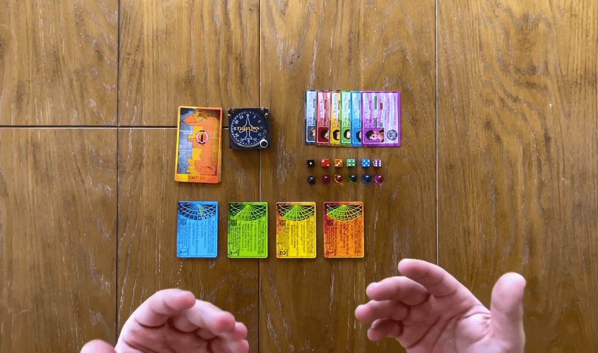 This photo showcases a screenshot from the rule book video tutorial for The Great Chase. It has all of the game components on the tabel for me to describe the game setup